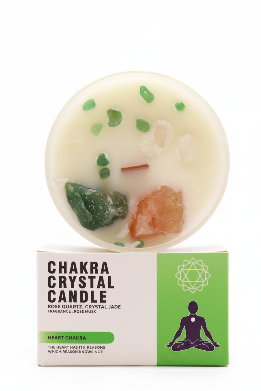 A chakra crystal candle with rose quartz, crystal jade, and rose musk wax, shown with its white and green packaging box on a white background.
