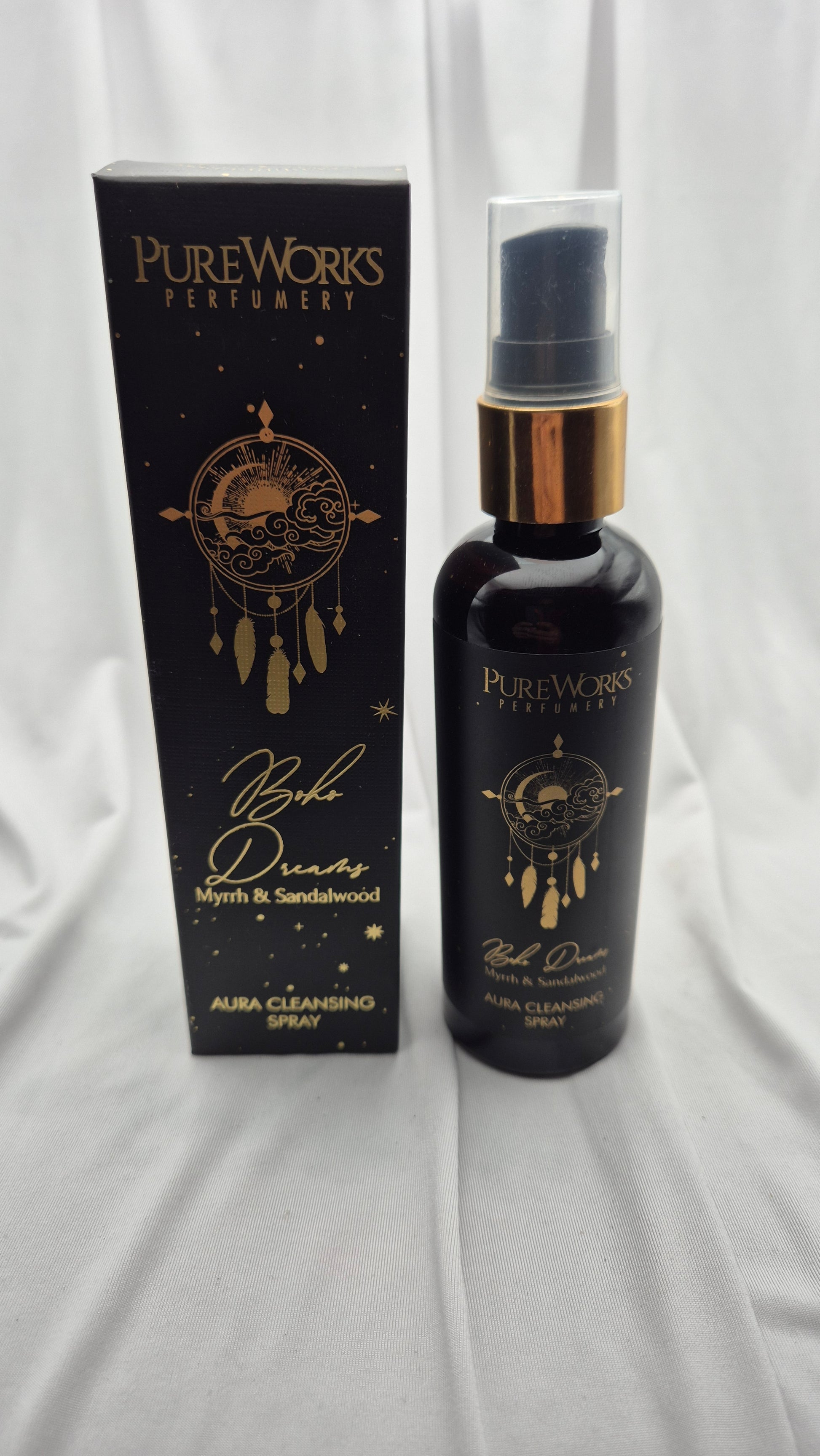 PureWorks Perfumery 'By The Dream' Myrtle & Sandalwood Aura Cleansing Spray, shown with its black packaging box and the dark glass spray bottle featuring gold lettering and a gold collar.