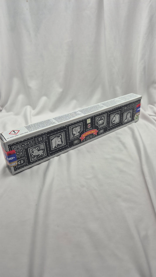 A long rectangular product box with a black, white, and gray illustrated design and small red accents, photographed on a white fabric backdrop.